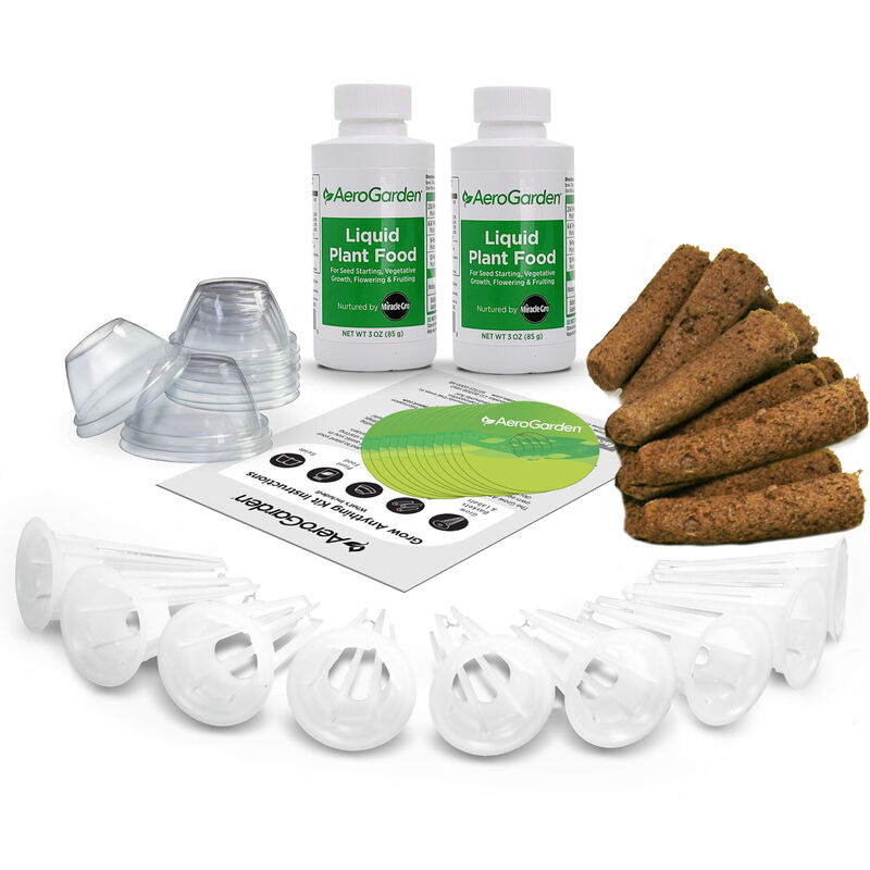 AeroGarden seed starting system: two bottles of liquid plant food, six tall plastic seed starting domes, six plastic inserts, six AeroGarden pods, and instruction booklets. 