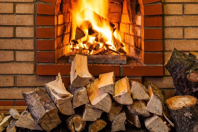 Stack of Firewood and Fireplace